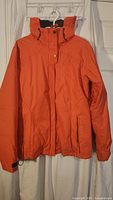 Full view of orange shell jacket front