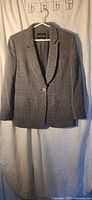 Front view of gray houndstooth blazer