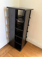 Full view of black CD tower showing shelves and overall design
