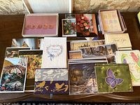 Overview of all boxed and loose vintage notecards on table