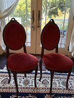 Front view of both mahogany side chairs showing overall design