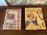 Overview of both boxed card sets on tabletop