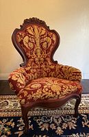 Full front view of spoon back armchair