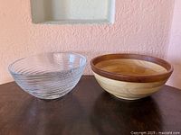 Glass spiral bowl and wooden bowl side by side