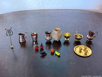 Full group of miniature metalware, wicker vase, glass fruit, and tray