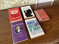 All five books laid out on table