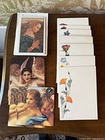 Overall lot showing wildflower stationery and two stacks of art note cards