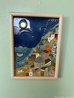 Front view of framed Capri ceramic wall plaque