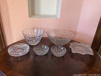 Front view of all six cut glass pieces