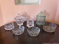 All seven glass pieces on tabletop