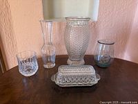 All five glass items arranged on table