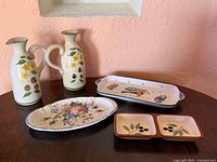 All five ceramic pieces displayed together