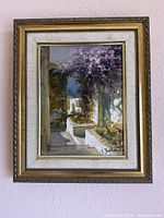 Framed impressionist painting on wall
