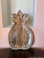 Front view of carved wooden pineapple tray