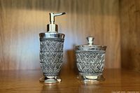 Soap dispenser and lidded holder front view showing design and size