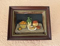 Front view of framed alabaster still life