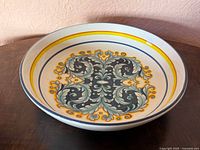 Top view of bowl showing floral scroll design and banding