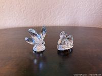 Front view of crystal butterfly and swan figurines