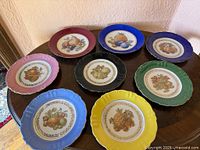 Top-down view of all eight fruit plates on table