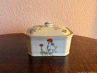 Front view of rectangular porcelain dish with lid showing wildflower pattern
