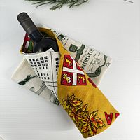 Wine bottle wrapped in Canada calendar tea towel