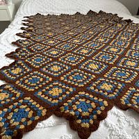 Afghan spread on bed showing full size and pattern