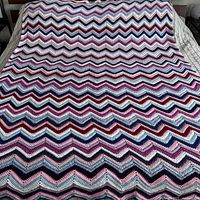 Full view of afghan covering king mattress