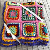 Afghan folded and tied with ribbon