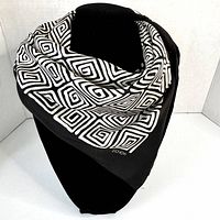 Full view of Echo black and cream silk scarf on mannequin