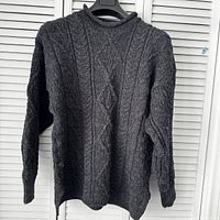 Full front view of sweater on hanger