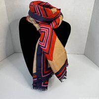 Scarf draped on display bust showing colors and pattern