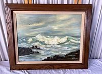Frontal view of framed seascape painting