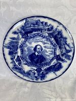 Front of plate showing flow blue portrait design and overall condition