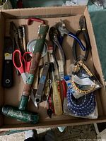 Overview of box with assorted tools and packaged cords