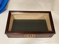 Top view of wooden glass-top display case with PCI logo