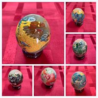 Collage showing six hand-painted jade dragon eggs on stands