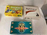 Three game boxes: Teacher's Quiz 2, Psychologizer, Eye Remember