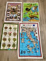 All four linen tea towels laid out on floor