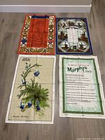 Group shot of four linen tea towels laid out flat