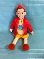 Front view of 15 in talking Pinocchio doll with original try-me tag