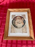 Front view of framed religious mirror picture
