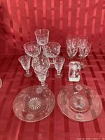 Group shot of all crystal stemware, plates and block