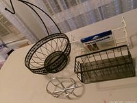 Group shot of all metal kitchen organizers and fruit basket