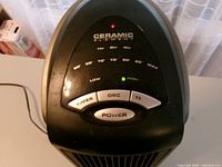 Top control panel showing brand, buttons and lights