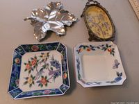 Four trinket dishes grouped