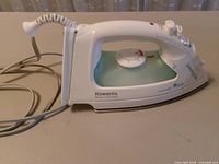 Left side view showing brand, model, water tank and cord