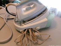 Complete Rowenta DG980 steam station iron showing base, water tank and cords
