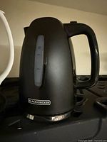 Full view of Black & Decker black electric kettle showing water gauge and handle