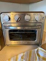Front view of Geek Chef air fryer toaster oven showing control panel and exterior condition