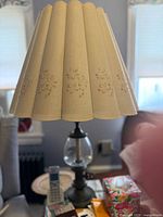 Full view of lamp showing shade, glass globe, metal base